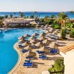 the pool, beach umbrellas and the Red Sea in Egypt